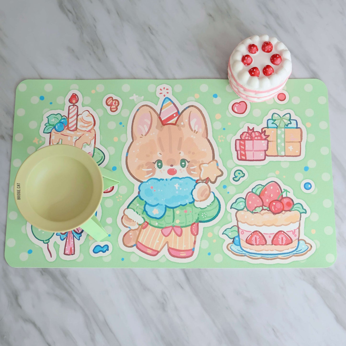 This photo showcase our birthday collection pet food mat in green.